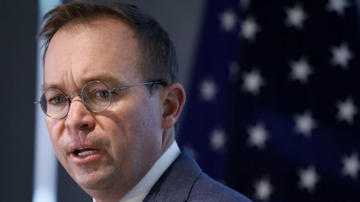 Mick Mulvaney speaks during a news conference after his first day as acting director of the Consumer Financial Protection Bureau in November.