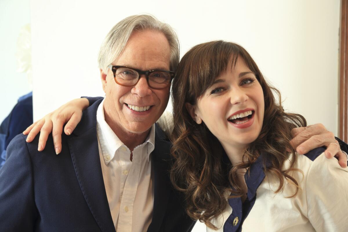 Tommy Hilfiger with actress Zooey Deschanel, who collaborated with him in 2014.