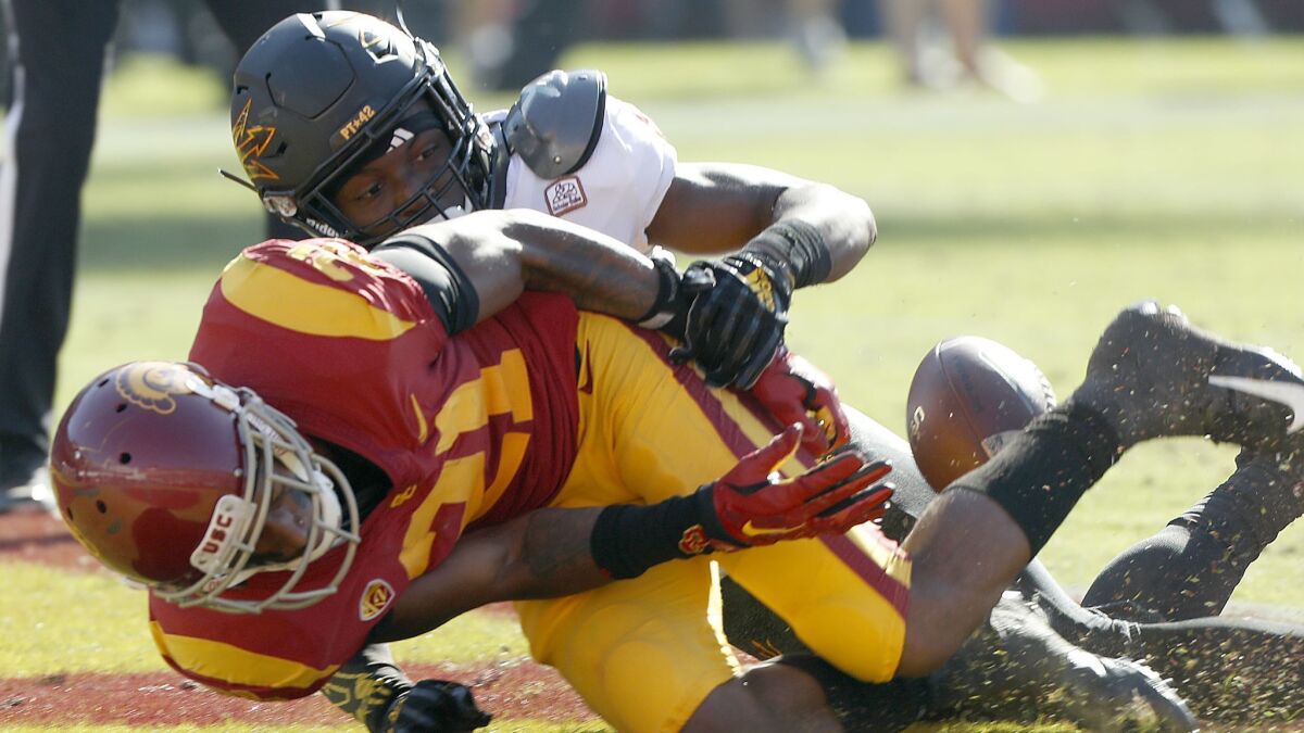 Arizona State cornerback Kobe Williams strips the ball away from USC wide receiver Tyler Vaughs, preventing what would have been a touchdown in the third quarter.