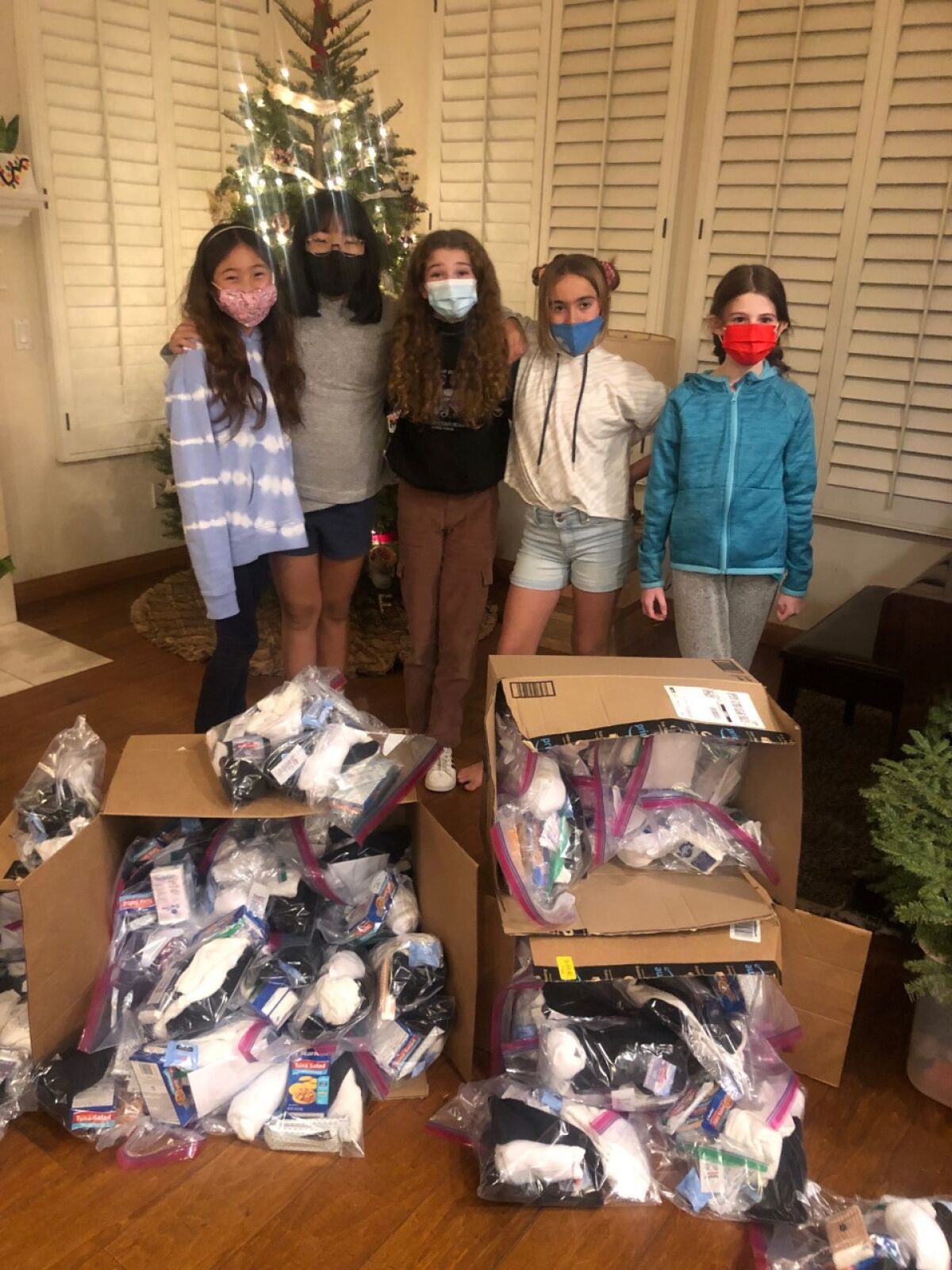 (L-r) Girl Scouts Charlotte, Caroline, Paige, Quincy and Sara with the “comfort packages” they assembled.
