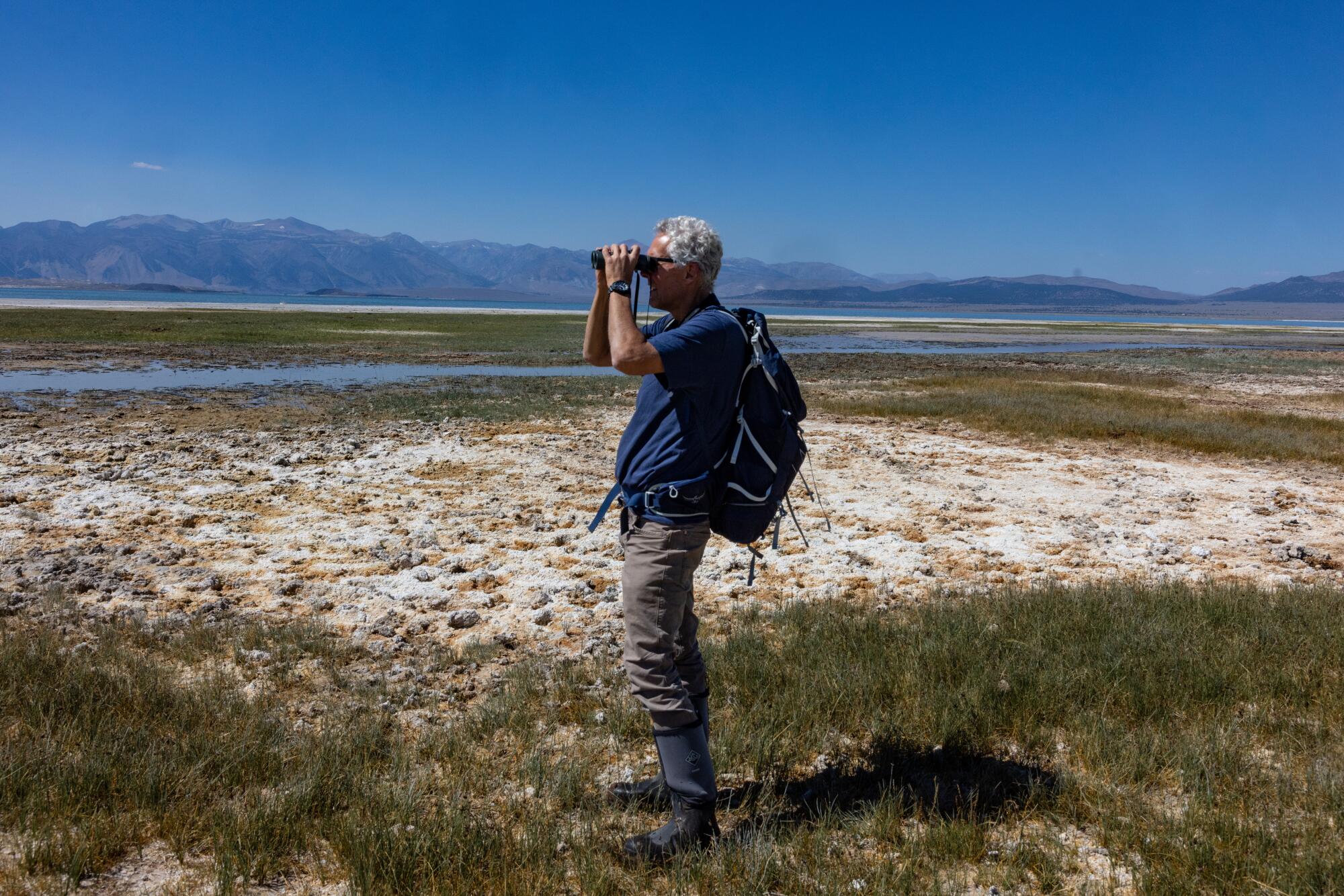 Bartshe Miller looks out onto the landscape at Mono Lake.