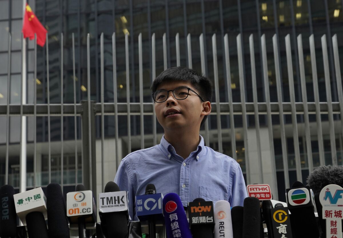 Pro-democracy activist Joshua Wong, speaking at an Oct. 29 news conference, became the young face of Hong Kong protests in 2014.