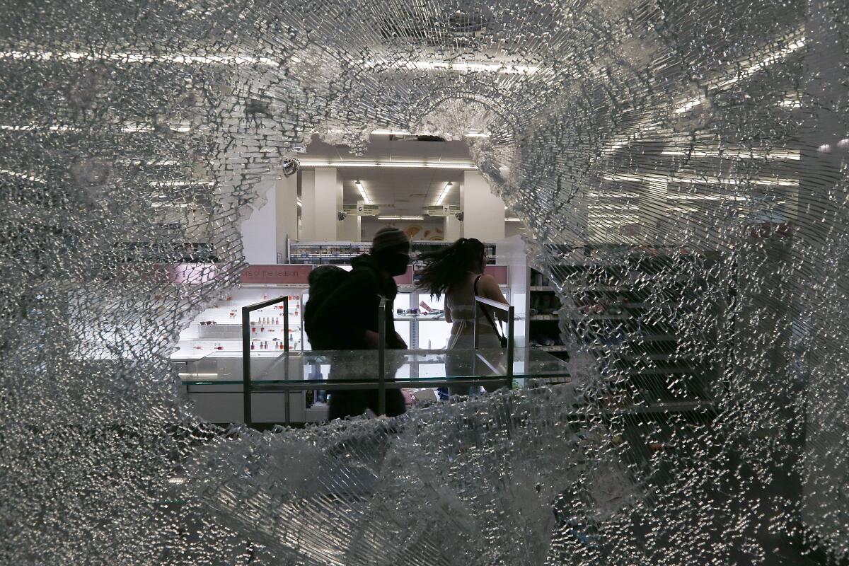 
Looters ransack a Walgreens store along Broadway in downtown Los Angeles, Saturday, May 30, 2020.