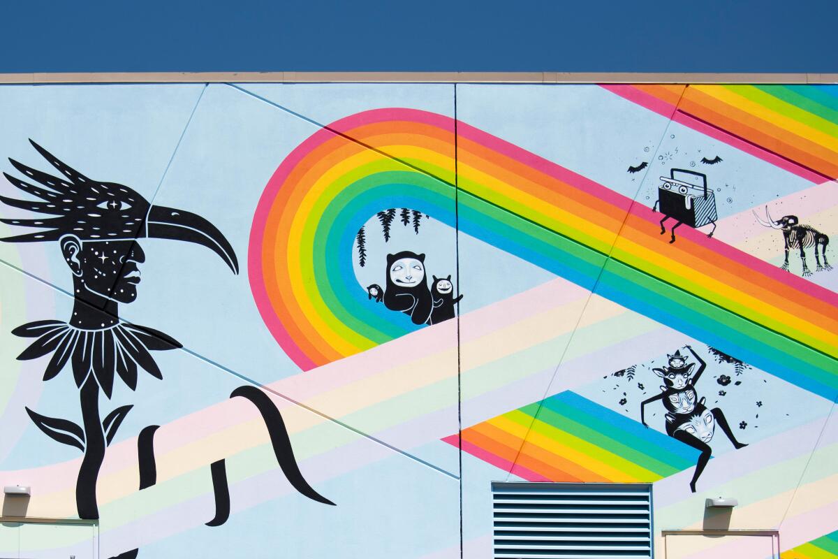 Multiple artists worked on Meow Wolf's mural outside of its Grapevine Mills mall location. 