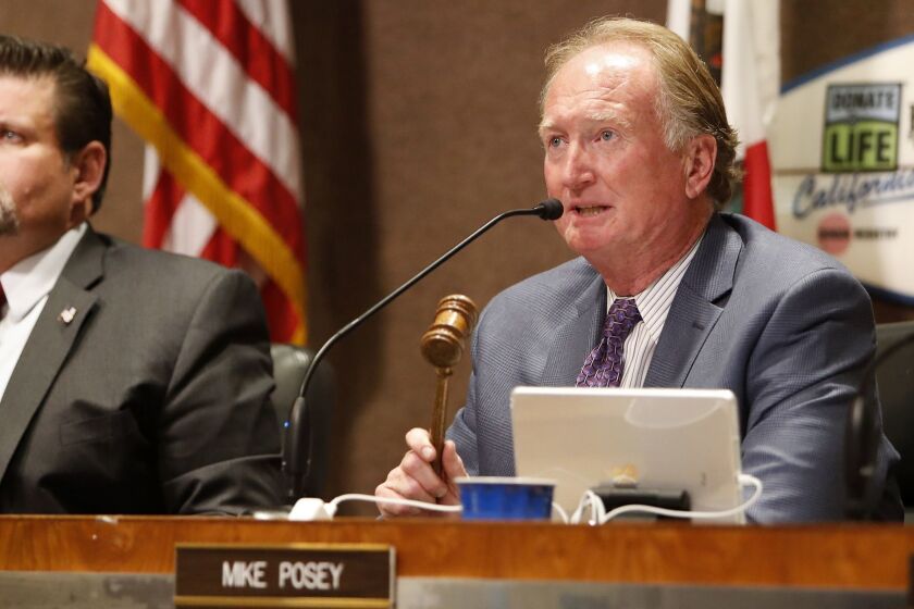 Mayor Mike Posey asks the public for order during public comments regarding Senate Bill 54, or the California Sanctuary State Bill, at Huntington Beach City Hall on Monday, April 2.