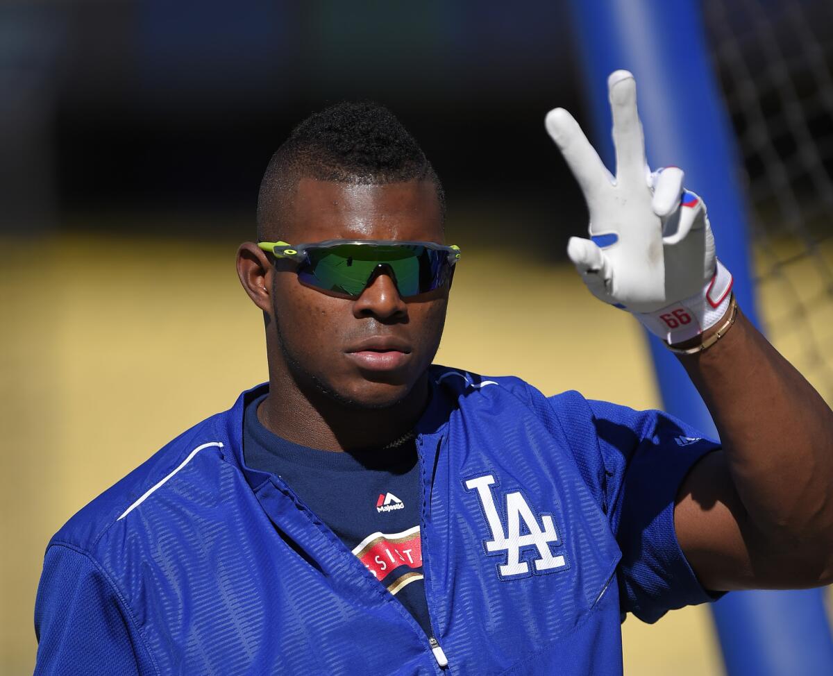 Dodgers outfielder Yasiel Puig prepares to take batting practice before a game against the Giants on June 19.