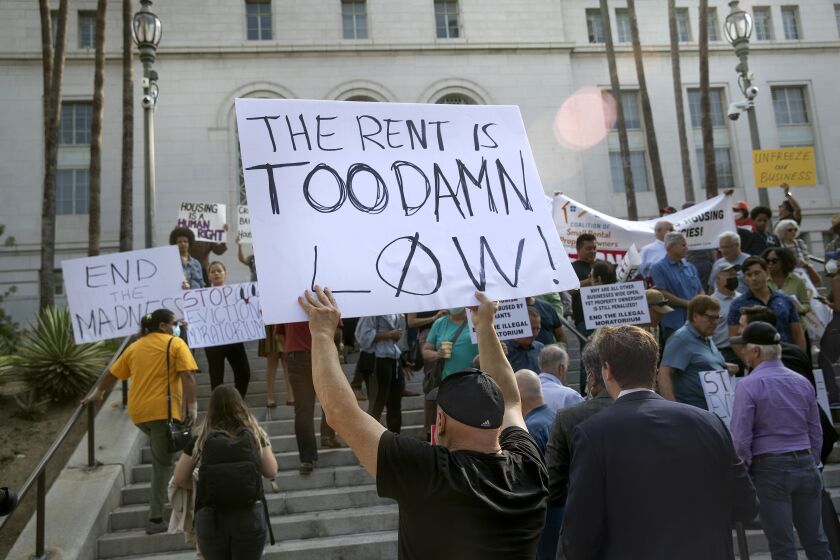 LOS ANGELES, CA-July 27, 2022: People, mostly in support of ending the eviction moratorium, protest outside of Los Angeles City Hall on July 27, 2022. (Mel Melcon/Los Angeles Times)