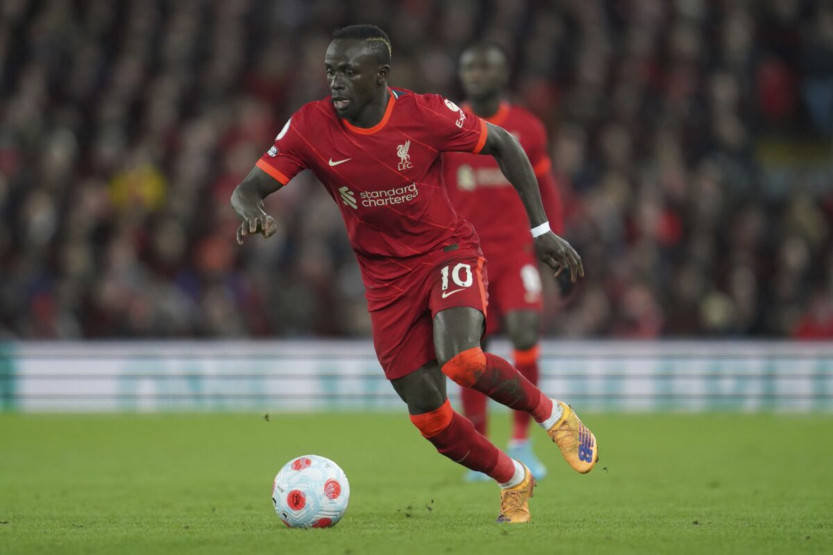 Liverpool's Sadio Mane takes control of the ball during the English Premier League soccer match between Liverpool and West Ham United at Anfield stadium in Liverpool, England, Saturday, March 5, 2022. (AP Photo/Jon Super)
