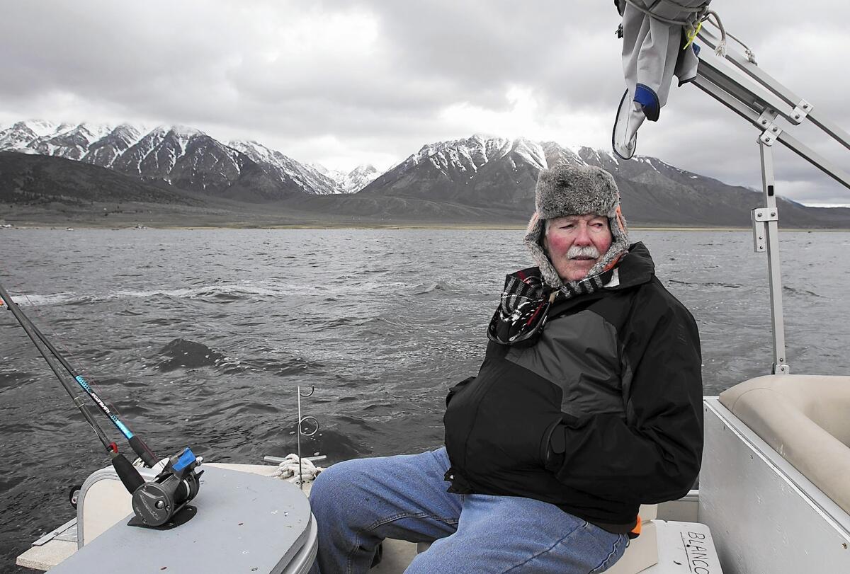 Dick "Hoagie" Hoagland of Newport Beach tries to stay warm in the 28-degree air at Crowley Lake on April 30. Hoagland, 78, has fished for trout in California's High Sierra on opening day for the past 50 years.