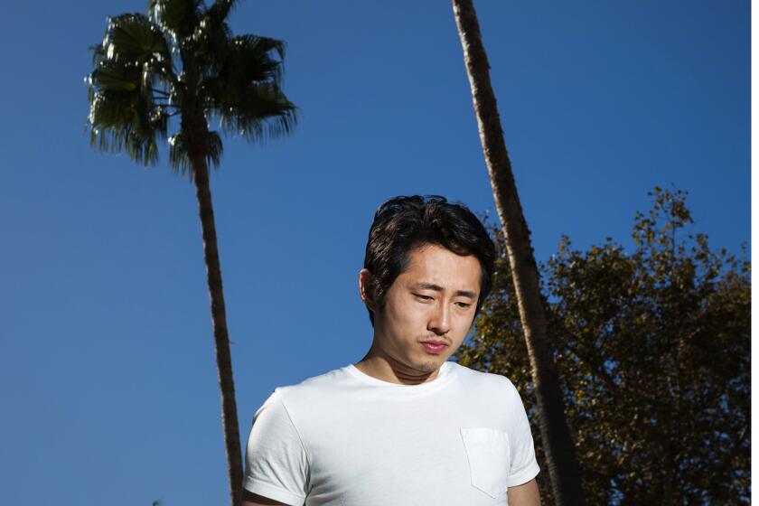 Actor Steven Yeun, from AMC's "The Walking Dead," is photographed in the Los Angeles neighborhood of Miracle Mile.