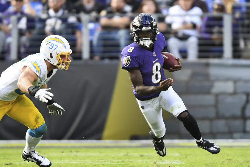 Baltimore Ravens quarterback Lamar Jackson (8) runs the ball against Los Angeles Chargers.