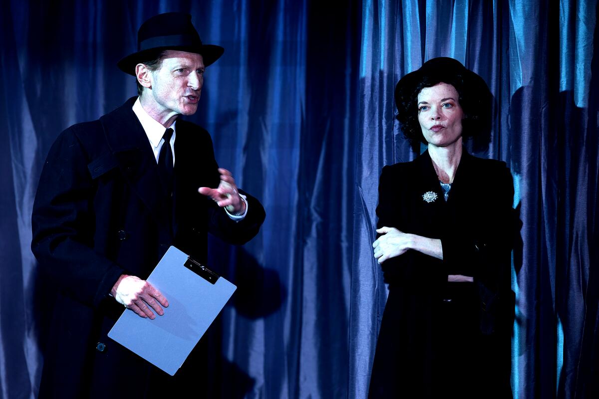 Leo Marks and Ann Noble wear black suits and hats in "Crevasse."