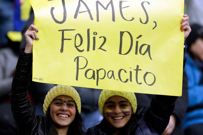 Supporters of Colombia's national soccer team player James Rodriguez display a banner that reads in Spanish " James, happy day daddy" prior a Copa America Group C soccer match between Colombia and Peru at the Bicentenario German Becker stadium in Temuco, Chile, Sunday, June 21, 2015. The banner refers to the fathers' day celebration.(AP Photo/Ricardo Mazalan)