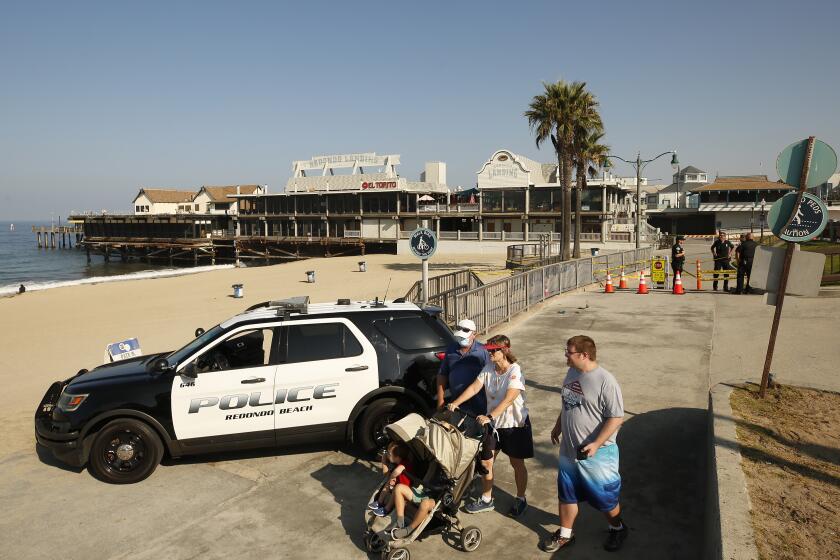 REDONDO BEACH, CA - AUGUST 26: Redondo Beach Police have closed access to the Redondo Beach Pier Thursday morning after two people were injured and a suspect is dead in a officer involved shooting Wednesday night. Officers responded to a shooting and found two victims. Officers located a suspect and fired at him killing him at the scene. Redondo Beach Pier on Thursday, Aug. 26, 2021 in Redondo Beach, CA. (Al Seib / Los Angeles Times).