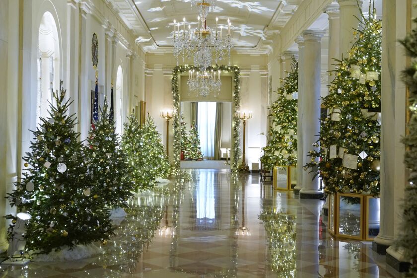 Cross Hall of the White House is decorated for the holiday season during a press preview of holiday decorations at the White House, Monday, Nov. 28, 2022, in Washington. (AP Photo/Patrick Semansky)