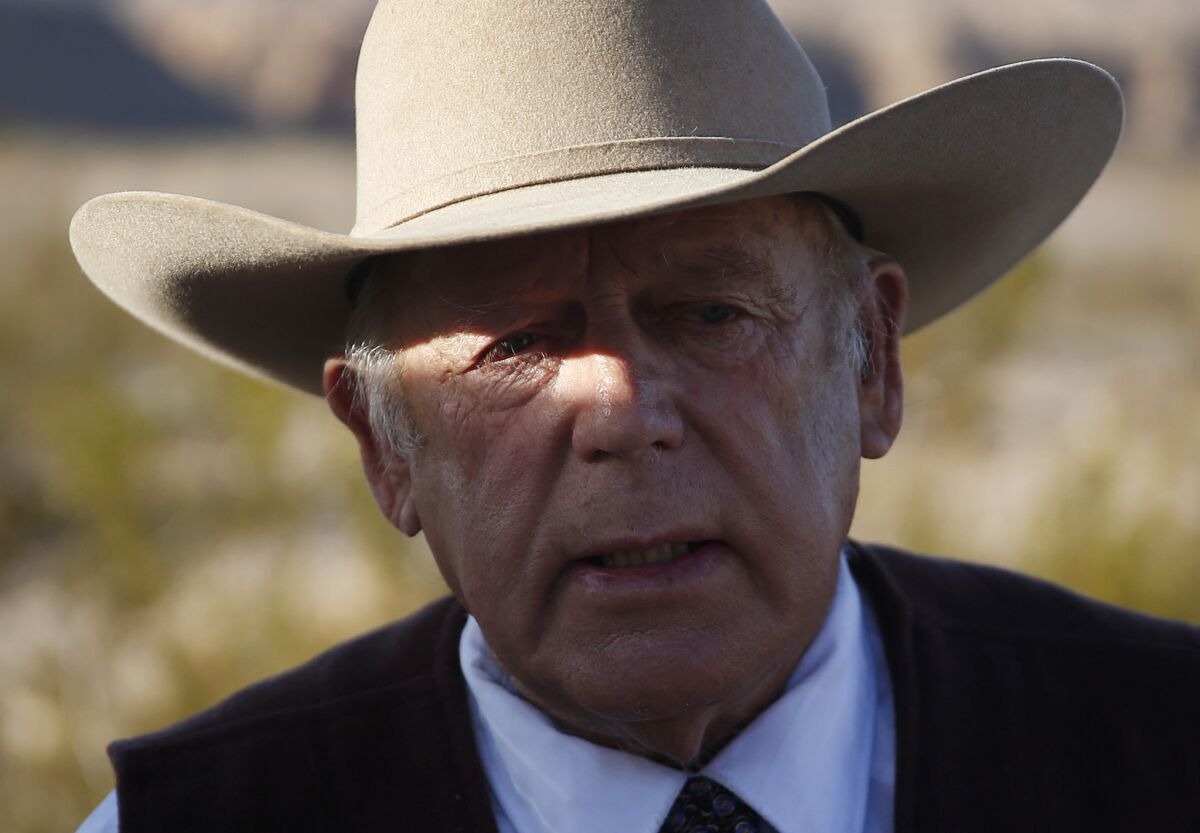 Rancher Cliven Bundy speaks to reporters on Jan. 27 in Bunkerville, Nev. He was arrested this week at the Portland, Ore., airport, apparently on his way to show support for his incarcerated sons and others who led the armed occupation of the wildlife refuge.