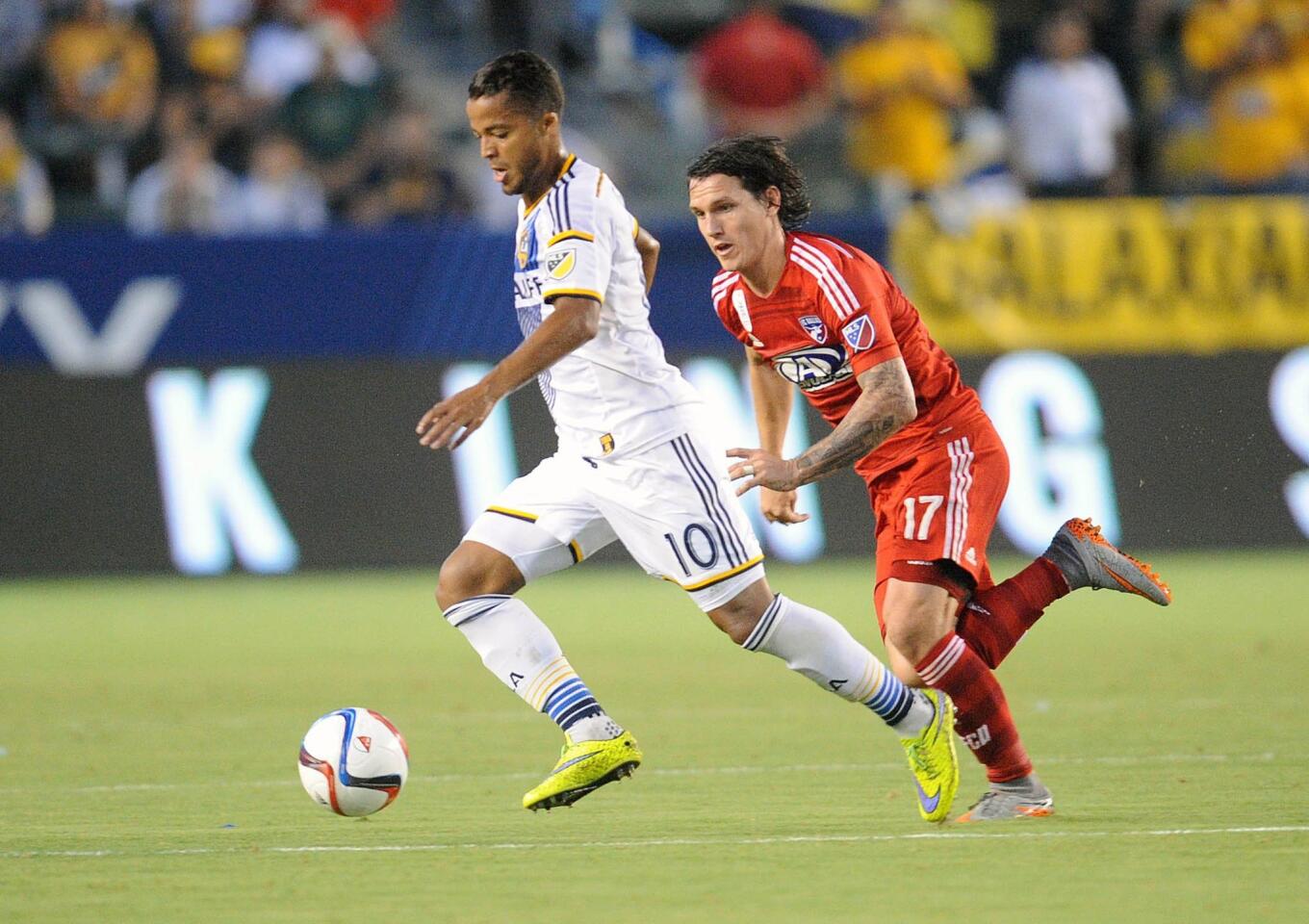 September 27, 2015; Carson, CA, USA; Los Angeles Galaxy midfielder/forward Giovani Dos Santos (10) moves the ball against FC Dallas defender Zach Loyd (17) during the first half at StubHub Center. Mandatory Credit: Gary A. Vasquez-USA TODAY Sports ** Usable by SD ONLY **