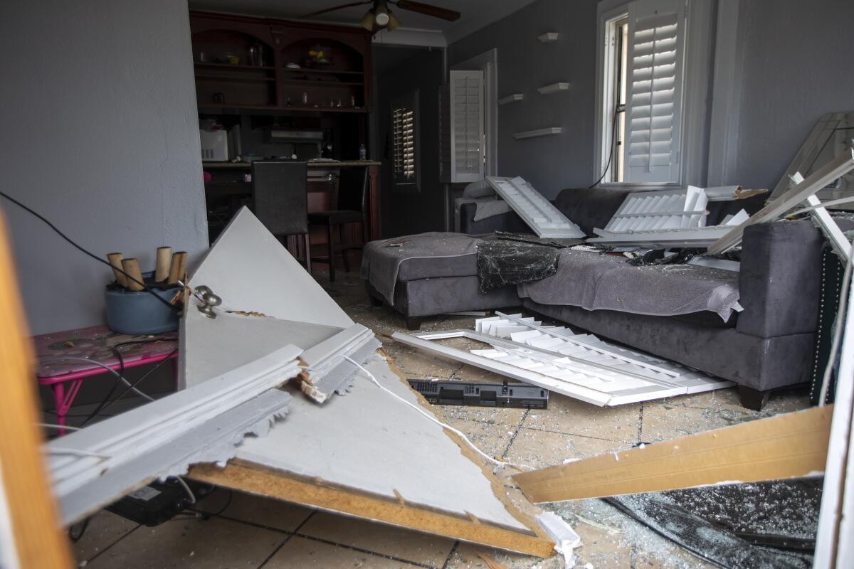 An interior of a damaged home.