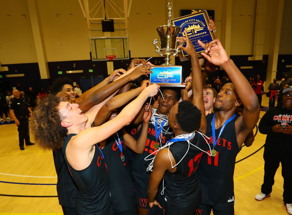 Westchester players celebrate their 68-43 win over Fairfax in the City Section Open Division title game Feb. 29, 2020.