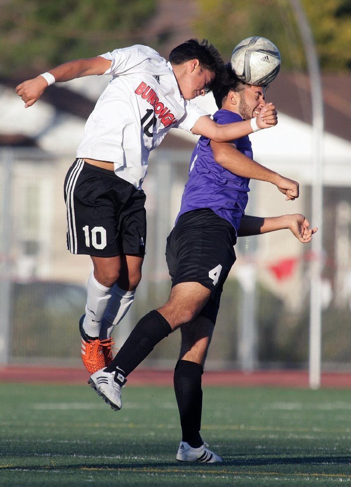 Burroughs' William Rosales heads the ball against Hoover's Benik Housepian.