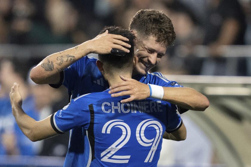 CF Montreal midfielder Mathieu Choiniere (29) is congratulated on his goal against the Columbus Crew by teammate Joaquin Sosa (3) during the first half of an MLS soccer game, Wednesday, May 15, 2024 in Montreal.(Christinne Muschi/The Canadian Press via AP)