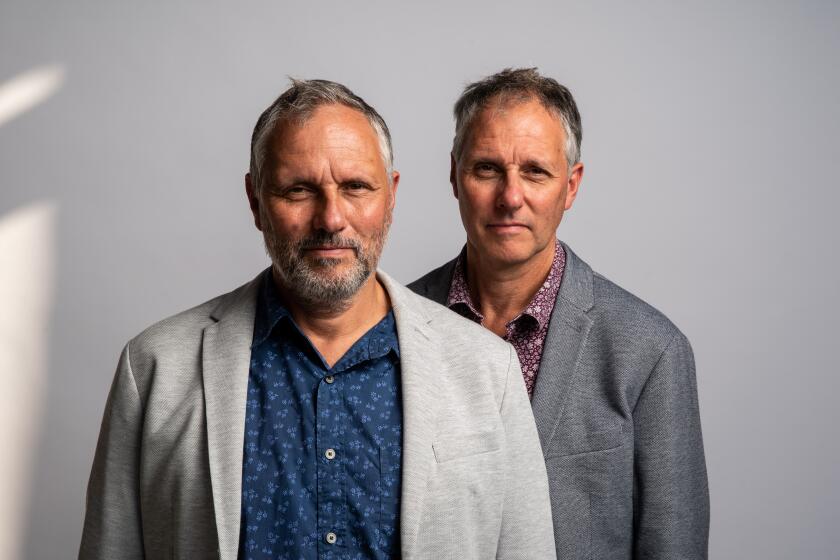 LOS ANGELES , CALIF. - OCTOBER 15: Twin brothers Marcus and Alex Lewis, from the documentary film, “Tell Me Who I Am” pose for a portrait at Netflix on Tuesday, Oct. 15, 2019 in Los Angeles , Calif. (Kent Nishimura / Los Angeles Times)