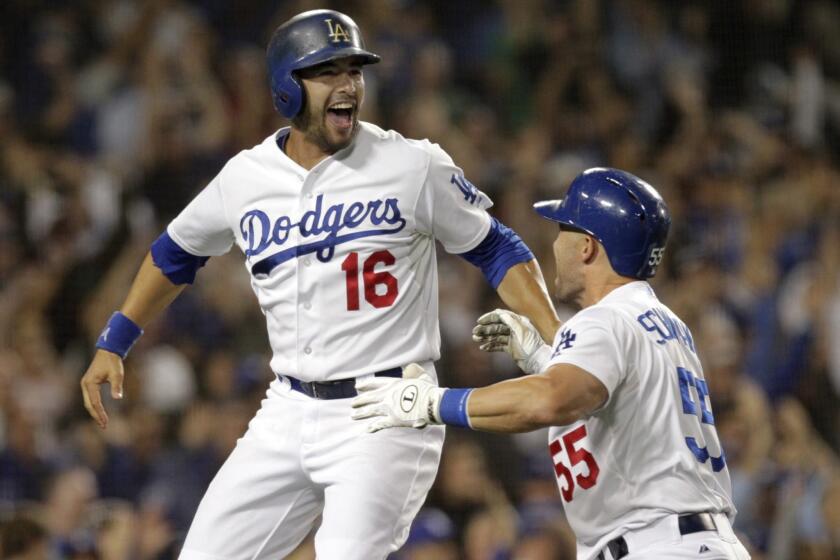 Dodgers center fielder Andre Ethier, left, celebrates with teammate Skip Schumaker after scoring the winning run in the Dodgers' 3-2 walk-off victory over the New York Yankees on Tuesday.