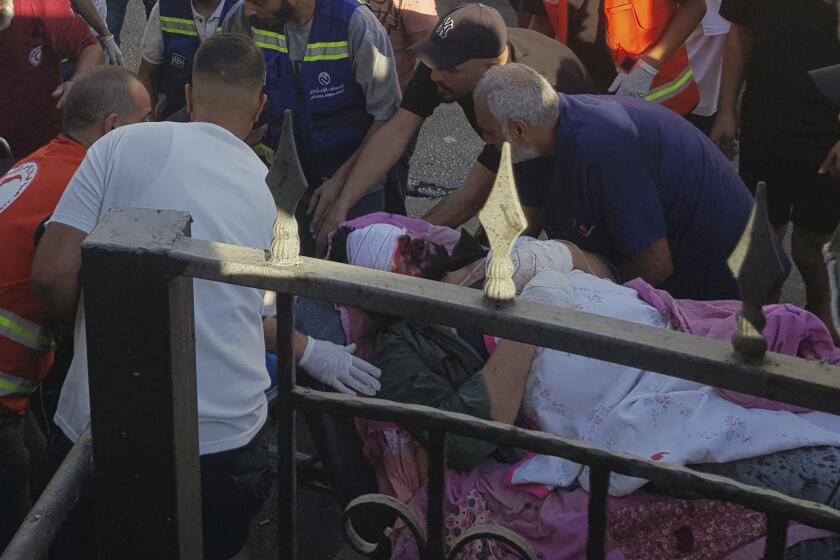 Civil Defense first-responders carry a man who was wounded after his handheld pager exploded, in the southern port city of Sidon, Lebanon, Tuesday, Sept. 17, 2024.(AP Photo)