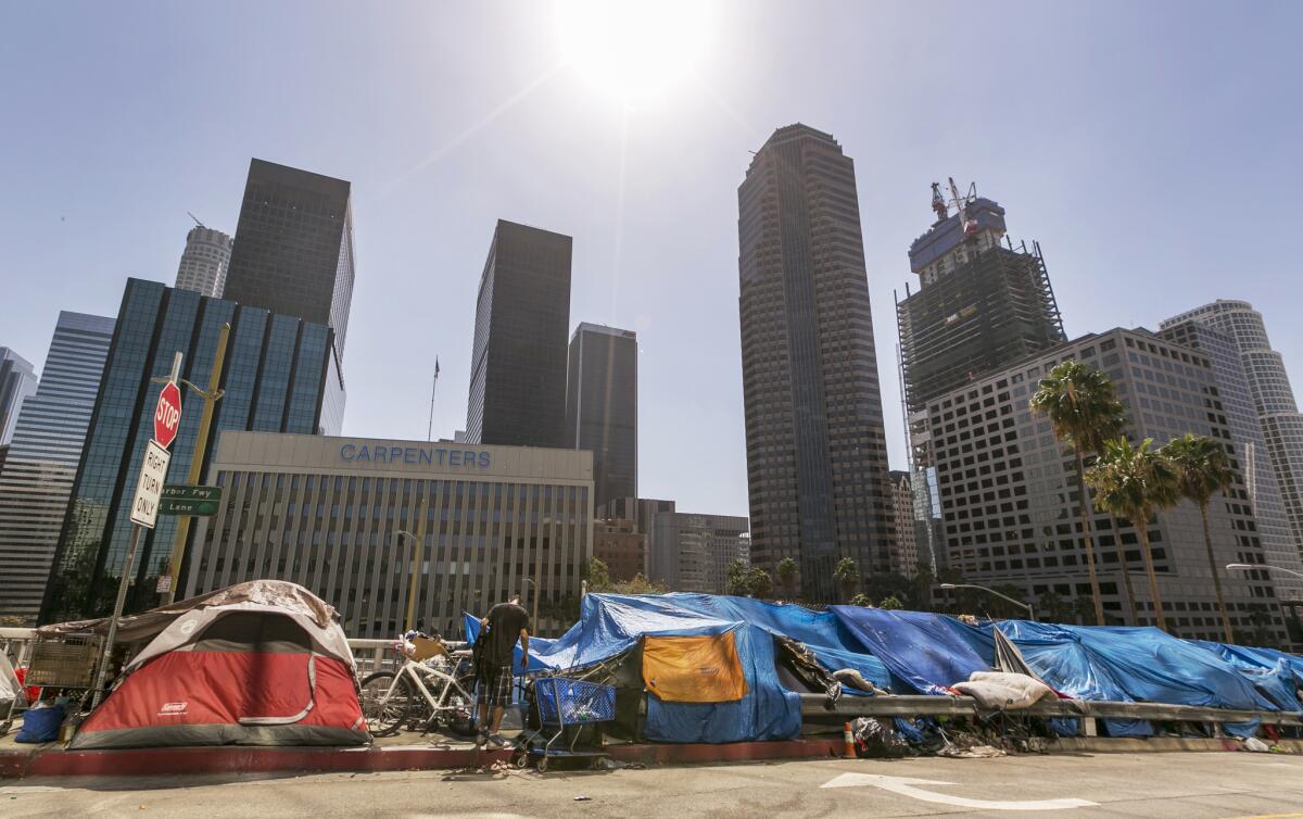 Tents used by the homeless line a downtown street on Sept. 22. City officials say they will declare a state of emergency on homelessness and propose spending $100 million to reduce the number of people living on L.A.'s streets.