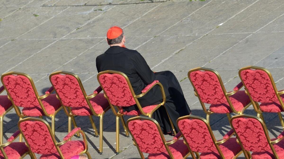 Cardinal Roger Mahony sits in St. Peter's Square last February ahead of Pope Benedict XVI's last weekly audience.