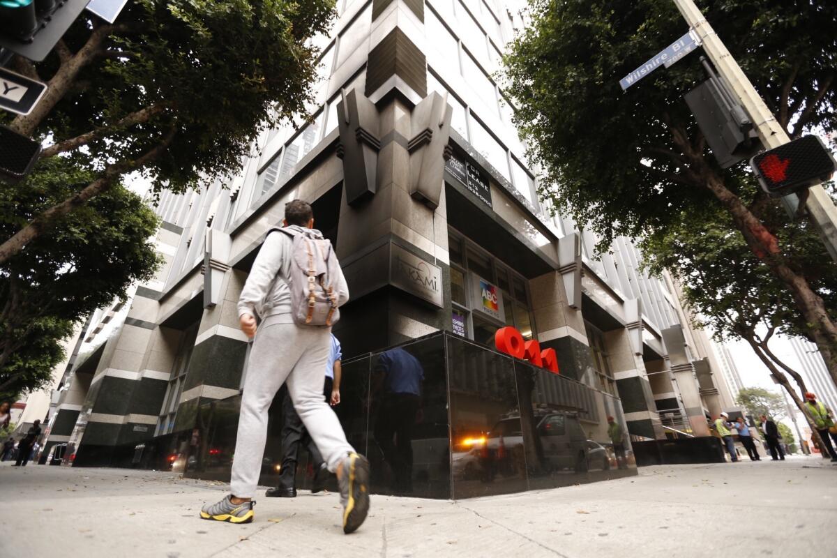 Smoke damage is visible on the exterior of a downtown building at the corner of Wilshire Boulevard and Flower Street, which was red-tagged after an underground electric generator exploded.
