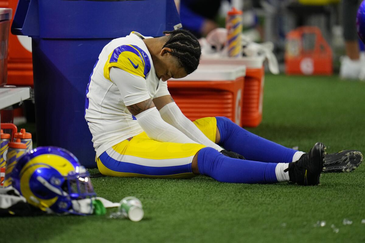 Rams cornerback Cobie Durant (14) looks down as he sits on the ground.