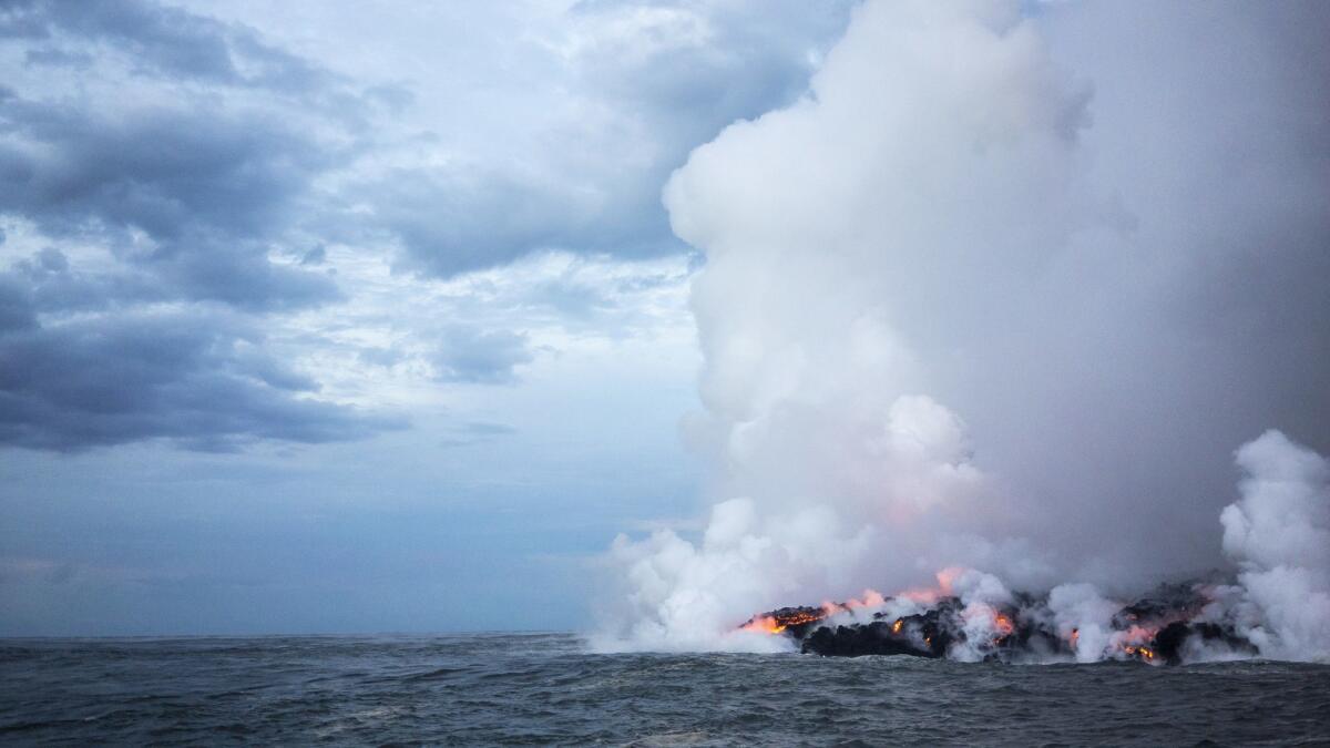 Lava flows into the ocean off the shore of Pahoa, Hawaii.