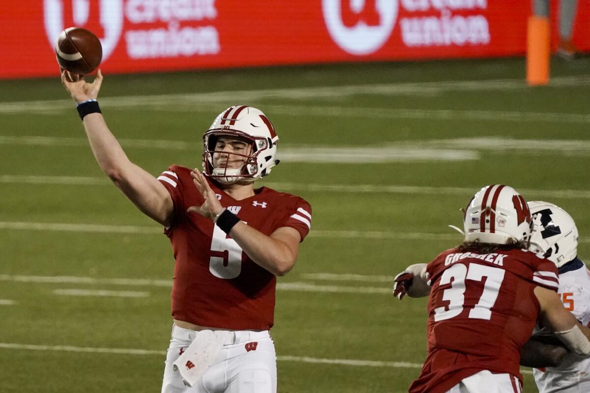 Wisconsin quarterback Graham Mertz throws a pass during the first half against Illinois on Oct. 23, 2020.