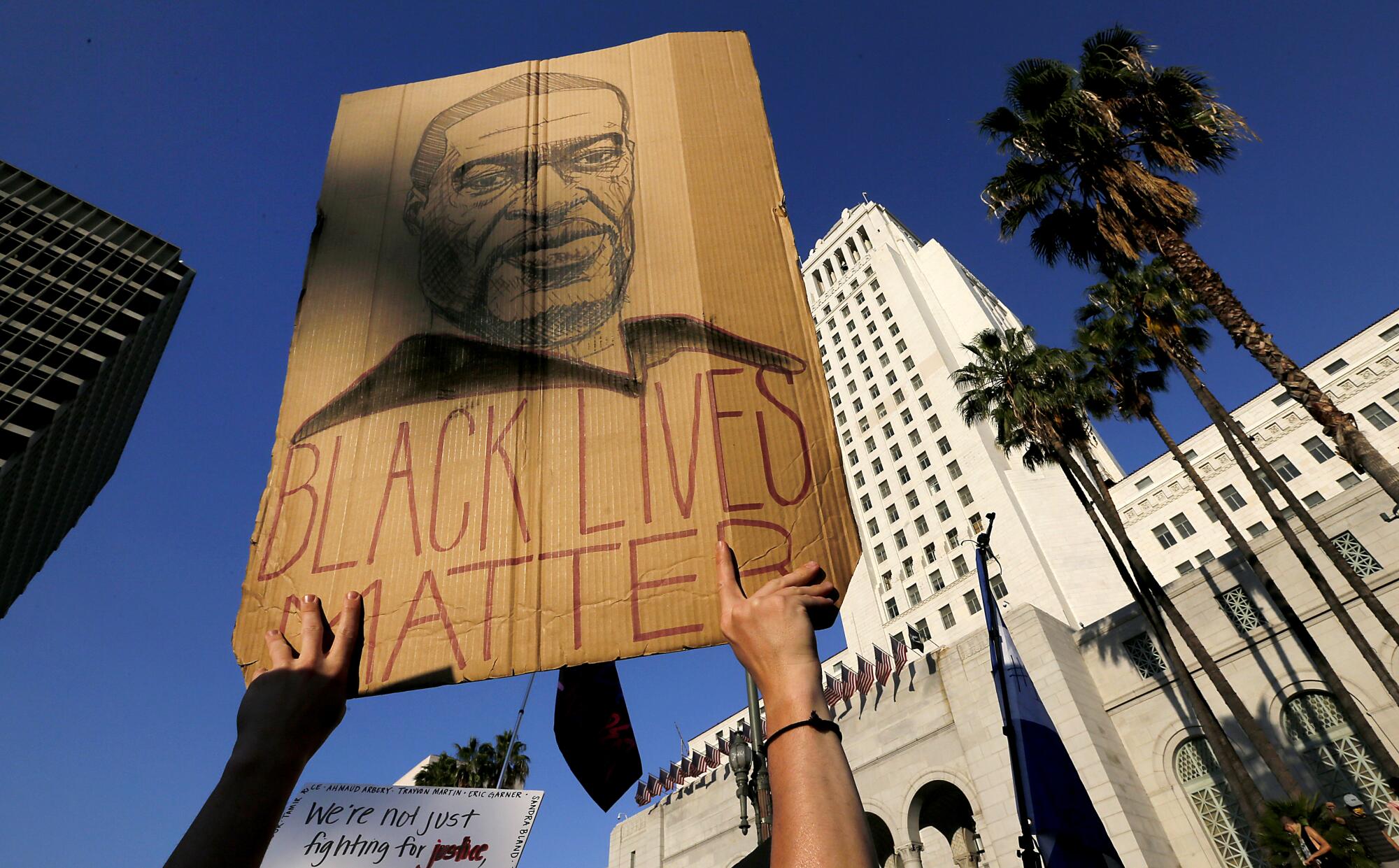 Thousands of protesters gather at the Los Angeles Civic Center to demonstrate for justice for George Floyd.