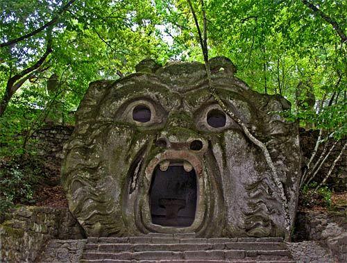 The fantastical stone gallery at Bomarzo is attributed to Vicino Orsini, circa 1570, and is said to be in the Mannerist style of art that evolved after the High Renaissance.