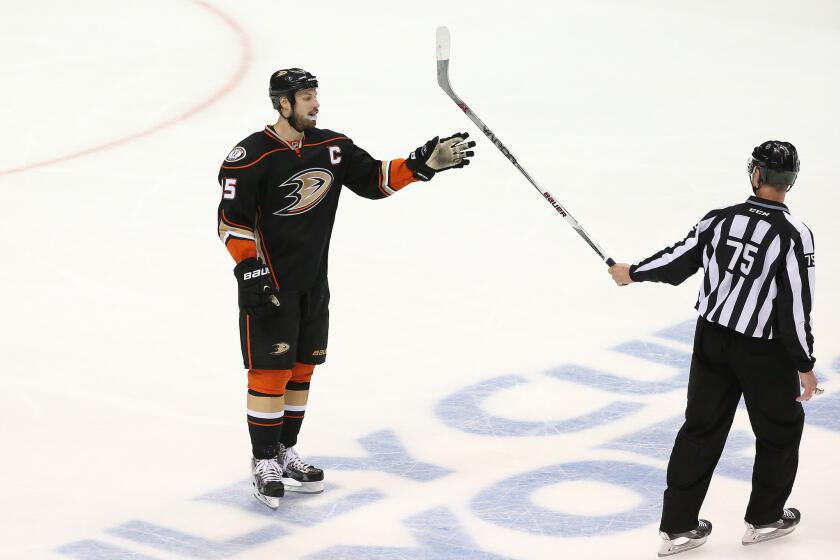 Ducks center Ryan Getzlaf gets his stick handed to him by the linesman after losing control of it during the third period of Game 1 against the Blackhawks.