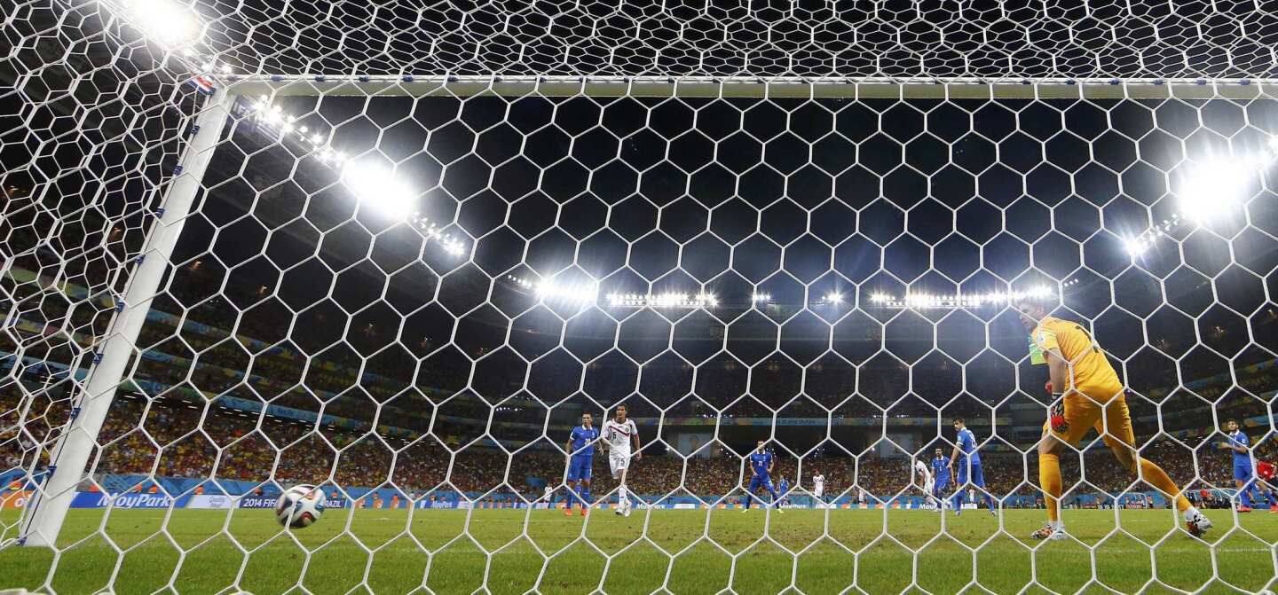 Greece's goalkeeper Karnezis watches as a ball shot by Costa Rica's Ruiz enters the goal during their 2014 World Cup round of 16 game at the Pernambuco arena in Recife