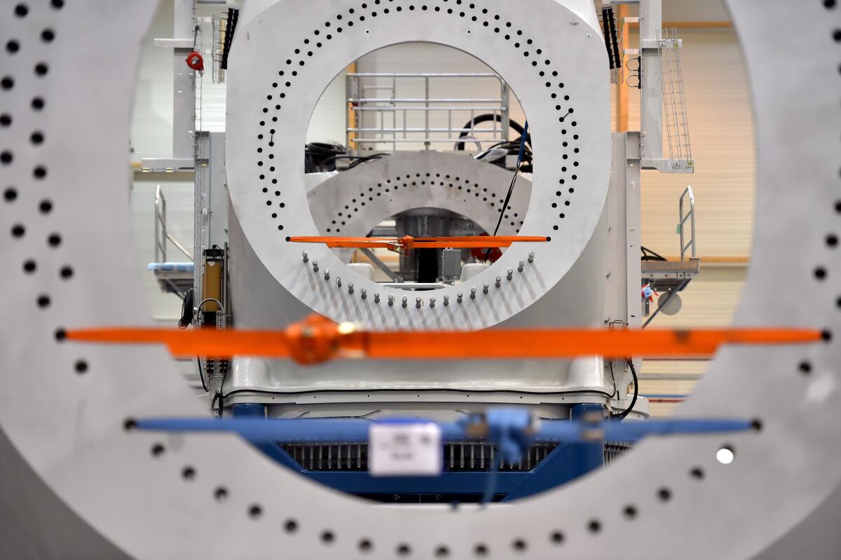 An offshore wind turbine is shown under construction at a GE factory in France.