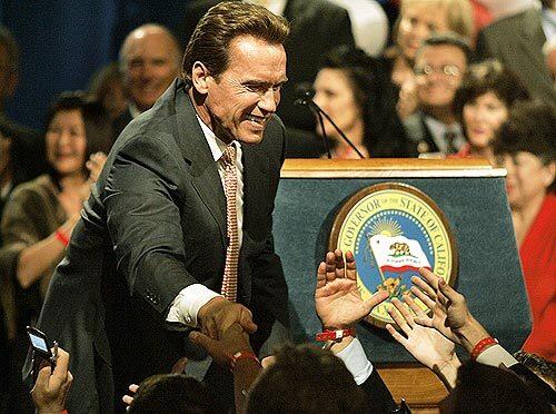 Arnold Schwarzenegger greets supporters after speaking at his invitation-only Election night celebration at the Beverly Hilton Tuesday.