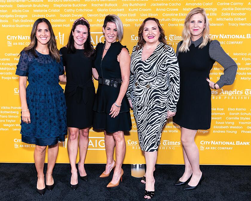 Too Faced Cosmetics president Tara Simon (second from right) attends with colleagues.