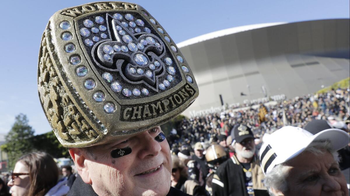 Saints fans gather outside Mercedes-Benz Superdome before the NFC championship game.
