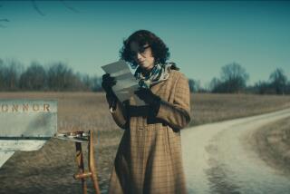 A woman reads a letter at a mailbox labeled "O'Connor."
