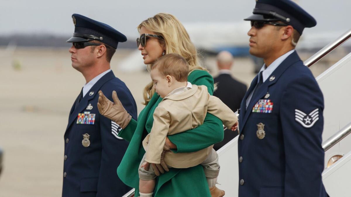 Ivanka Trump carries her son, Theodore Kushner, as they arrive at Andrews Air Force Base in Maryland.