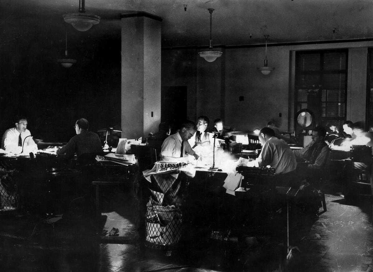 Dec. 10, 1941: During the first World War II blackout in Los Angeles, editors in The Times city room were allowed to work with desk lamps only.