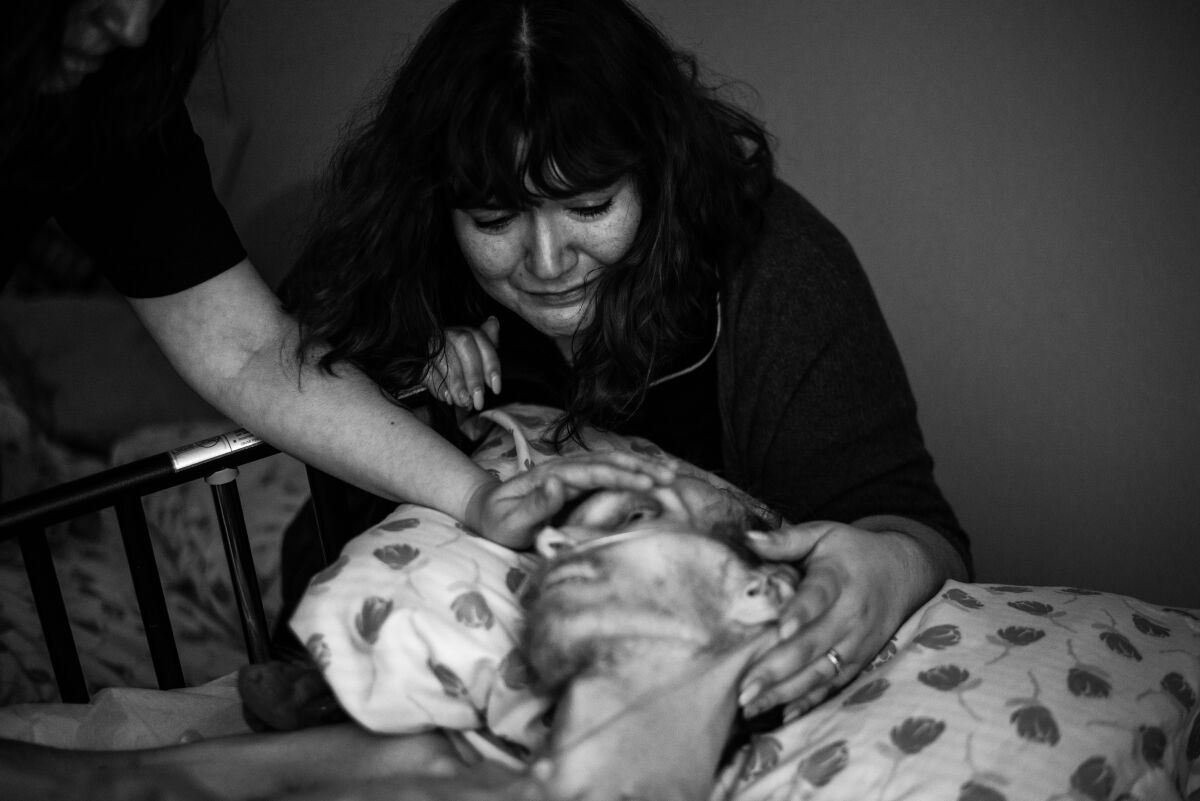 Amanda Villegas is shown with her husband, Chris Davis, before his 2019 death.