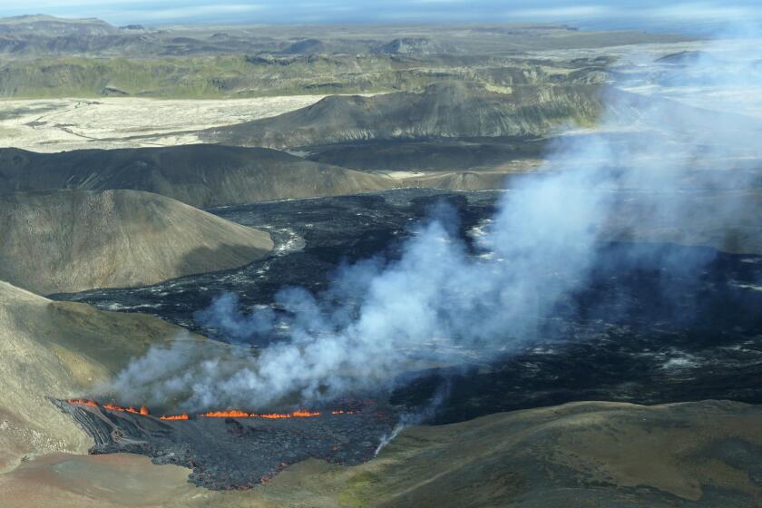 A aerial shot of activity from the Fagradalsfjall volcano in Iceland on Wednesday Aug. 3, 2022, which is located 32 kilometers (20 miles) southwest of the capital of Reykjavik and close to the international Keflavik Airport. Authorities in Iceland say a volcano in the southwest of the country is erupting just eight months after its last eruption officially ended. (AP Photo/Ernir Sn?r)