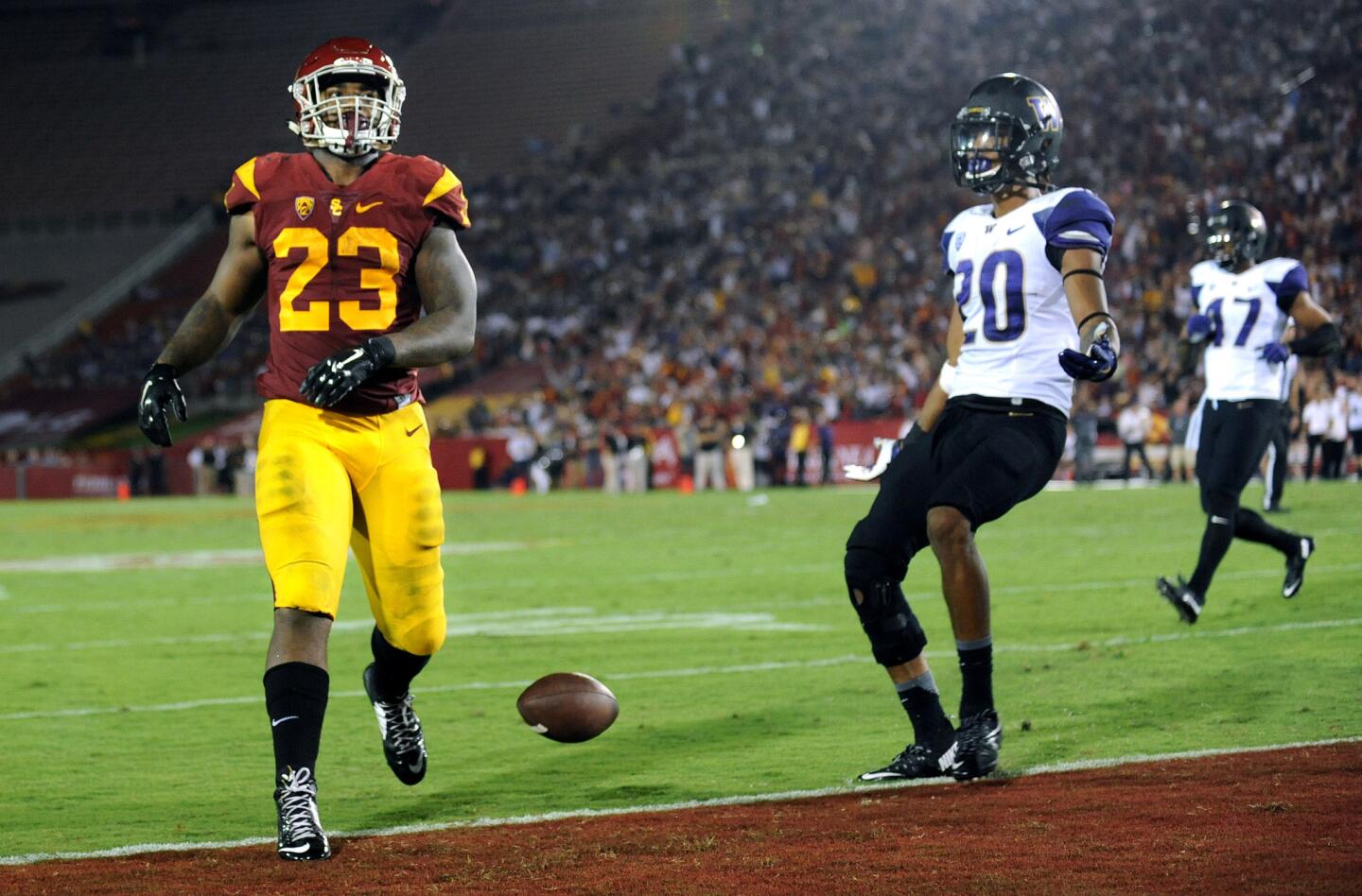 USC running back Tre Madden drops the ball on a two-point conversion against Washington in the fourth quarter at the Coliseum on Thursday.