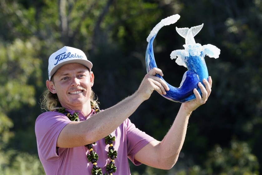 Cameron Smith holds the champions trophy after the final round of the Tournament of Champions golf event, Sunday, Jan. 9, 2022, at Kapalua Plantation Course in Kapalua, Hawaii. (AP Photo/Matt York)