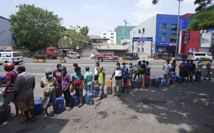 Sri Lankans queue to buy fuel at a fuel pump in Colombo, Sri Lanka, Thursday, March 3, 2022. Sri Lanka’s already dire economic crisis has deepened as oil prices hover near $110 a barrel. (AP Photo/Eranga Jayawardena)